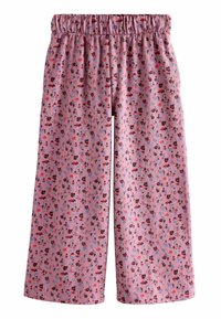 Rosa Blumenmuster-Hosen mit elastischem Bund, aus weichem Stoff gefertigt. Mit kleinen, bunten Blumen auf hellem Hintergrund.