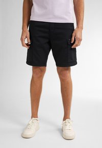 Zwarte cargoshorts van een katoenmix, met zijzakken, omgeslagen zomen en een losse pasvorm. Draagt u met witte sneakers.