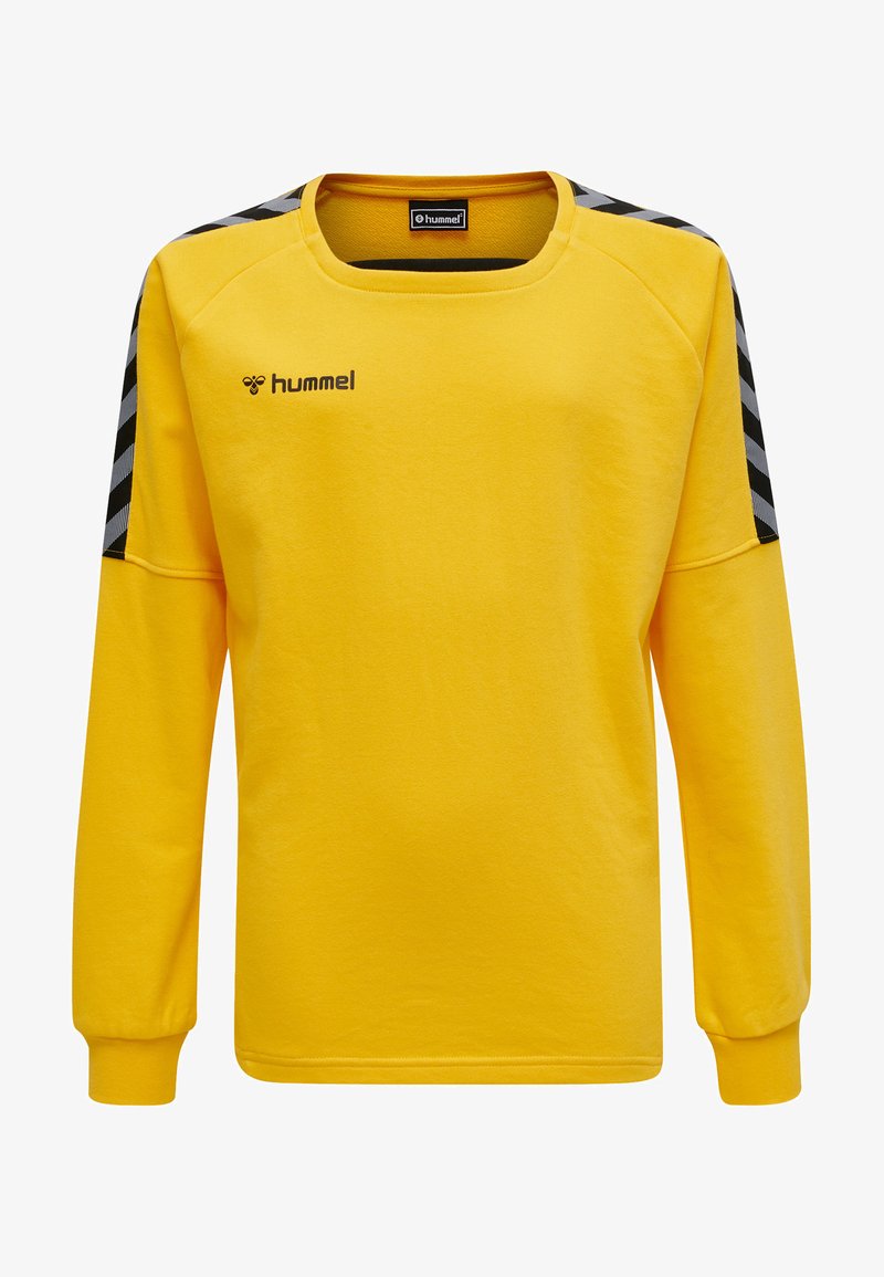 Langärmliges gelbes Sweatshirt aus weichem Stoff. Verfügt über schwarz-weiße Zickzack-Akzente an den Schultern und einen runden Halsausschnitt.