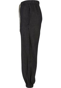 Dark gray, loose-fitting pants with an elastic waistband, white drawstring, side pockets, and elastic cuffs at the ankles.