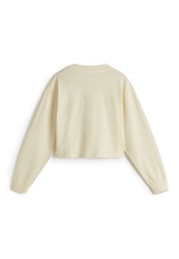 Gekürzter Langarm-Sweatshirt aus hellgelbem Baumwollstoff, mit einem gerippten Rundhalsausschnitt, überschnittenen Schultern und gesticktem Text auf der Rückseite.