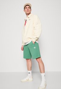 adidas Originals Spodnji deli trenirk - preloved green