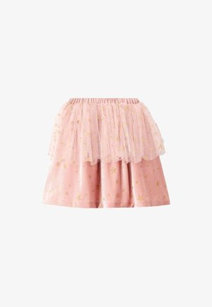 Jupe rose avec un superposé en tulle en couches. Arrière-plan en tissu lisse avec des imprimés d'étoiles dorées. Ceinture élastique pour un enfilage facile.