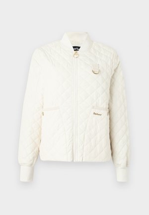 Veste crème matelassée avec un col côtelé, fermeture éclair et deux poches avant. Présente un accent en matériel doré et un logo discret.