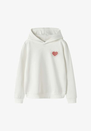 Sweat à capuche blanc à manches longues avec un petit cœur rouge entouré de rayons noirs sur le côté gauche de la poitrine.