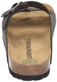 Black leather sandal with a cork footbed. It features a wide strap and a textured outsole. Notable brand logo printed on the insole.