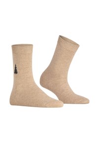 Beige Socken aus einer Baumwollmischung mit gerippten Bündchen und einem kleinen schwarzen Baumgrafikmuster nahe dem Knöchel. Weiche Textur und klassisches Design.