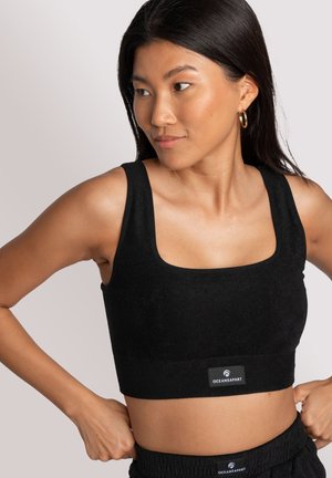 BEAUTY - Medium support sports bra - black