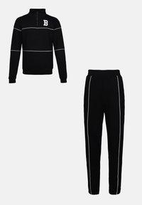 Black athletic tracksuit with a quarter-zip pullover and matching pants, featuring white stripes across the chest and down the sides.