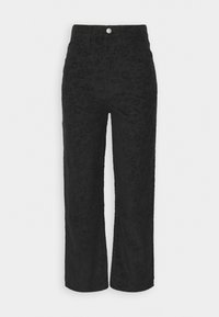 Pantalon en velours côtelé noir avec un motif texturé, taille haute, jambe droite et fermeture à bouton sur le devant.