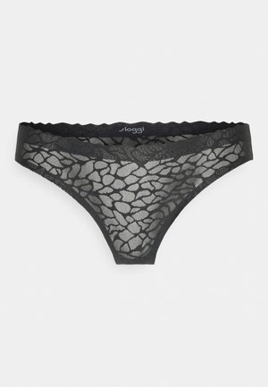 Zwarte lingerie string gemaakt van doorschijnende kant met een textuur en abstract patroon. Heeft gegolfde randen en een elastische tailleband.