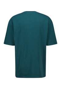 Teallinen puuvillapaita rennoilla mitoilla, lyhyillä hihoilla, pyöreällä kaula-aukolla ja sileällä pinnalla; yksinkertainen takapuoli ilman kuvioita tai yksityiskohtia.