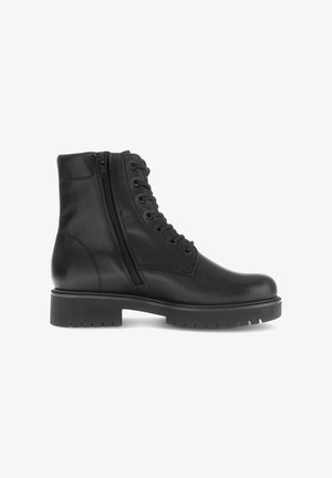 Black leather ankle boot featuring a round toe, contrasting laces, side zipper, and a textured rubber sole. Smooth finish and minimal detailing.