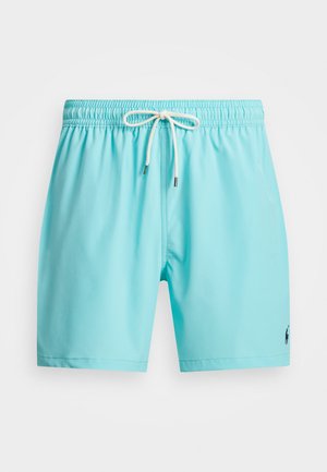 Light blue swim shorts made of smooth fabric, featuring an elastic waistband with a drawstring and a small logo on the lower right side.