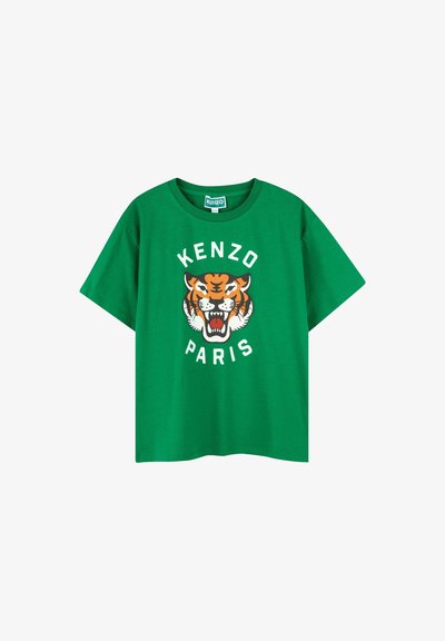 T-shirt en coton vert arborant un grand graphique de tigre orange avec des détails noirs et le texte "KENZO PARIS" en lettres blanches circulaires.