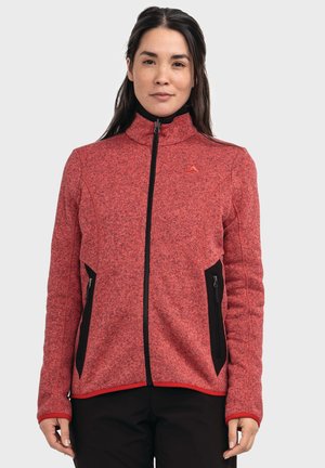 Rote Fleecejacke mit hohem Kragen, Reißverschluss vorne, schwarzen Reißverschlusstaschen und Akzentnähten. Verfügt über ein strukturiertes Strickmuster.