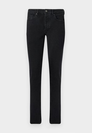 Mørk denim jeans med slim fit, fem lomme-design og metalknaplukning. Glat tekstur og jævn farve gennem hele stoffet.