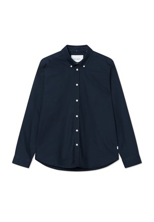Camicia azzurra scuro con bottoni, colletto classico, maniche lunghe e bottoni bianchi. Presenta un piccolo logo sul lato sinistro del petto. Tessuto di cotone.