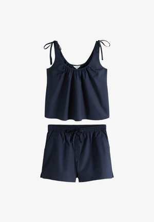 Top senza maniche blu navy con spalline da annodare e shorts coordinati con vita elasticizzata, progettati per un abbigliamento estivo casual.