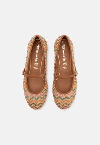 Woven flat shoes with a zigzag pattern in multicolored threads, brown leather trim, and a decorative strap with a metal buckle.