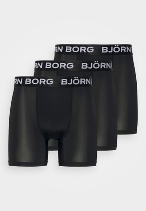 Schwarze Boxer-Briefs mit einem elastischen Bund, der das Logo "BJÖRN BORG" trägt. Glatte Textur und figurbetontes Design, verpackt als Set von drei.