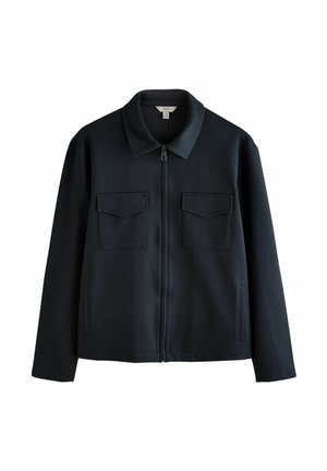 Tumši zilais zip-up džemperis ar punktveida apkakli, divām priekšējām kabatām ar vāku, sānu kabatām un gludu, teksturētu audumu.