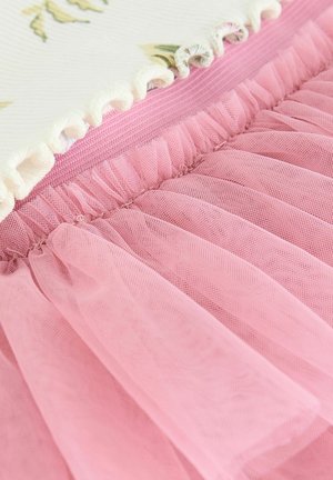 Layered dress featuring a floral patterned fabric, a pink ruffled waistband, and a pink tulle skirt with soft, sheer texture.