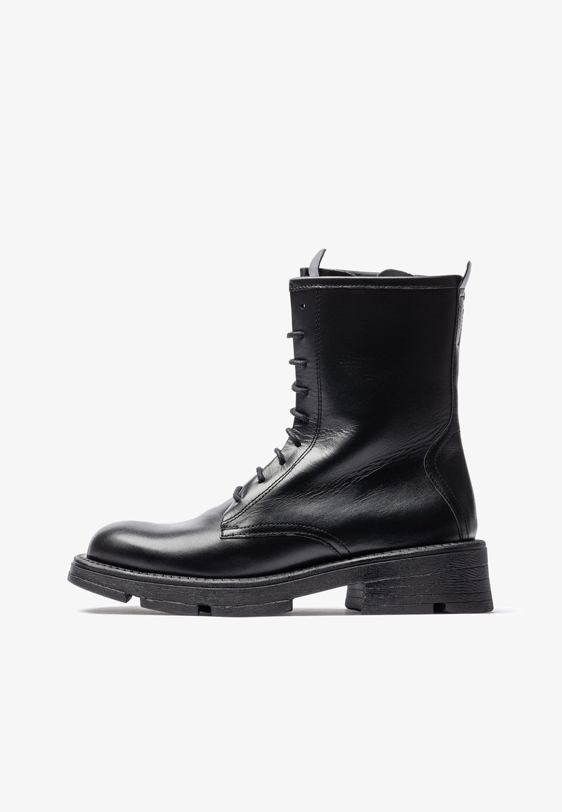 Black leather ankle boot with lace-up front, rounded toe, and textured rubber sole. Features a slight heel and smooth finish.