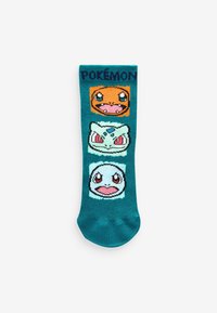 Turkusowe skarpetki z pikselowymi postaciami Pokémonów: Charmander, Bulbasaur i Squirtle. Każda postać ma wyraźne tło w formie bloku kolorowego.