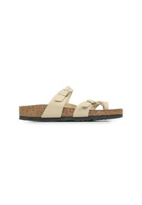 Sandali con tappetino in sughero beige caratterizzati da due cinghie regolabili, fibbie in metallo, una base texture e una suola in gomma nera rialzata.