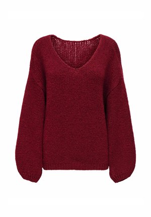 Pull tricoté rouge profond, coupe ample, col en V et manches longues bouffantes.