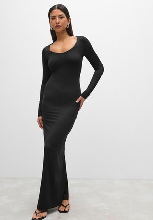 Black long-sleeve dress with a scoop neckline, form-fitting design, made of smooth fabric, featuring a flared hem and minimal embellishments.
