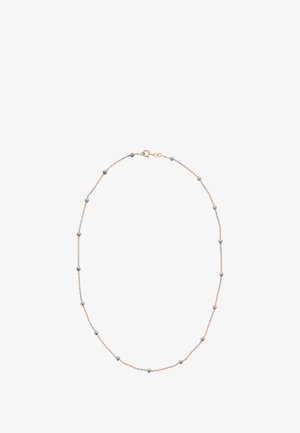 Halskette aus Gold- und silberfarbigen Tönen mit abwechselnd glatten Perlen, feinem Kettendesign und einer Karabinerverschluss. Eleganter und minimalistischer Stil.