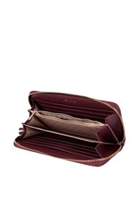 Burgundy leather wallet with gold zipper, multiple card slots, and a contrasting light interior featuring a dotted pattern.