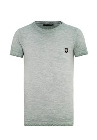 Lichtgroen, T-shirt met korte mouwen gemaakt van zachte, gestructureerde stof. Bevat een klein zwart schildlogo op de linkerborst.