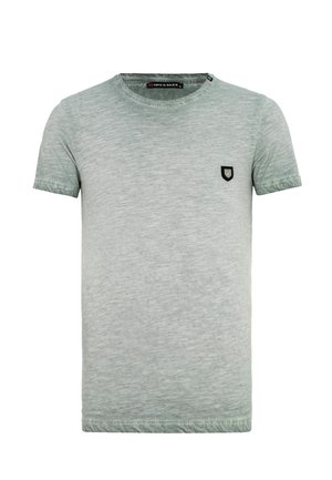 Lichtgroen, T-shirt met korte mouwen gemaakt van zachte, gestructureerde stof. Bevat een klein zwart schildlogo op de linkerborst.
