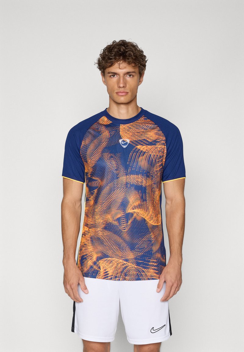 Blue and orange printed athletic shirt with short sleeves and round neckline; features a logo on the chest and a textured design.
