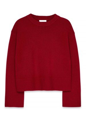 Sarkans saīsināts džemperis ar apaļu kakla izgriezumu, platām piedurknēm un ribotu aproci. Izgatavots no mīksta, teksturēta dzijas materiāla.