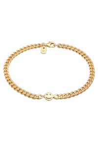 Goldfarbene Kettenarmband mit verschlungenen Gliedern, ausgestattet mit einem Smiley-Gesicht Charm und einem kleinen Anhänger mit einem Symbol, gesichert mit einem Karabinerverschluss.