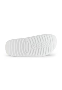 Hvit gummi såle med teksturerte riller og formet logo. Glatt overflate med avrundet tå og tydelig sviktsupport.