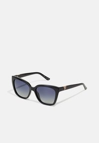 Black acetate sunglasses with a square shape and gradient lenses. Features a subtle gold accent on the outer sides of the frames.