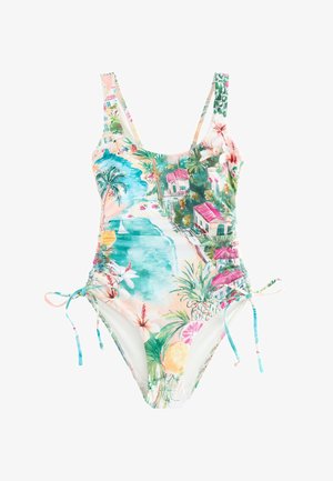 Floraler Bikini-Slip mit seitlicher Bindung und kleinen goldenen, sonnenförmigen Anhängern, die an gebräunter Haut hängen.