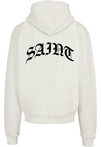 Weißer Kapuzenpullover mit schwarzem "SAINT"-Grafikdruck auf dem Rücken. Verfügt über eine Kordelzugkapuze sowie gerippte Bündchen und Saum für eine enge Passform.