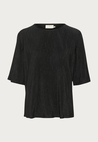 Haut noir à manches courtes avec un motif texturé. Coupe loose, encolure ras du cou et tissu lisse et léger. Pas de matériel visible.