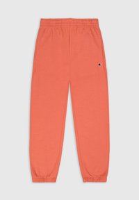Pantalons de survêtement corail en tissu doux, dotés d'une taille élastique et de poignets, avec des poches latérales et un petit logo sur la jambe gauche.