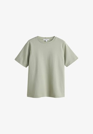 Világoszöld rövid ujjú pamut póló kerek nyakkivágással és egy kis márkajelzéssel a gallér belsejében.