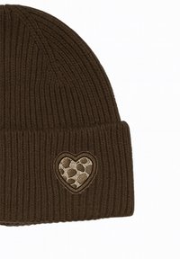 Brown ribbed knit beanie featuring a heart patch with a textured, leopard print pattern in beige and brown tones.