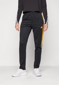 adidas Sportswear TIRO CUT 3 STRIPES TRACKPANTS - Treniņtērpa apakšdaļas - black/crew orange