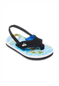 Sort flip-flop med en blå stofrem, der har en farverig strandscene med palmer på sålen og en hvid gummiydersål.