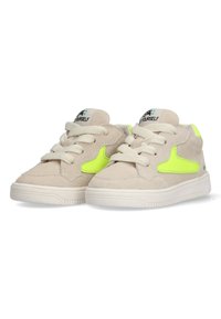 Beige suede sneakers with bright yellow accents, textured surface, and white rubber soles. Features traditional laces and tongue branding.